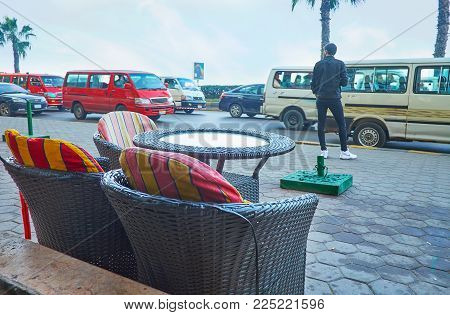 Alexandria, Egypt - December 18, 2017: Corniche Avenue Is Full Of Cafes And Restaurants With Open Ai