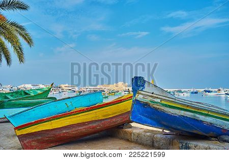 Pedestrian Promenade Along The Eastern Harbor Is Occupied With Many Wooden Boats Of Local Fishermen,