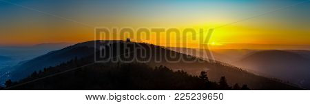 Silhouette Of Medieval Castle Tower On Yellow Sunsetbackground