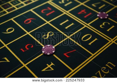 Casino table with chips. Roulette green table. Pocker game. Gambling and entertainment concept. Pocker table ready for player. Top view