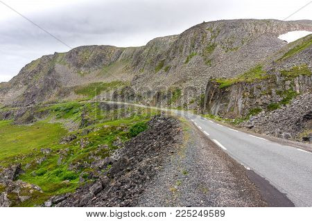 Rocky Cliffs On The Coast Of The Barents Sea Along The Varanger