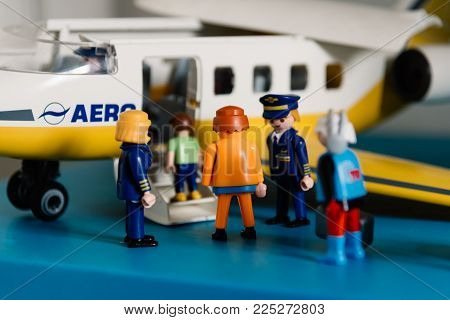 Madrid, Spain - June 30, 2017: Playmobil figurines in scene representing travelers boarding a plane in the airport