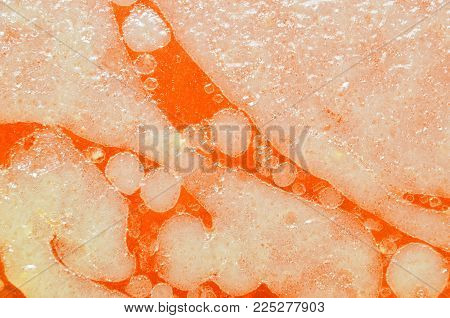 Shot of liquid fat from pork and oil