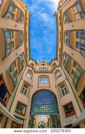 ORADEA, ROMANIA - JANUARY 27, 2018: Principal entrance in the Black Eagle Palace with glass covered passage, landmark of the city.Built between 1907-1908 by the architects Marcell Komor and Odso Jakob