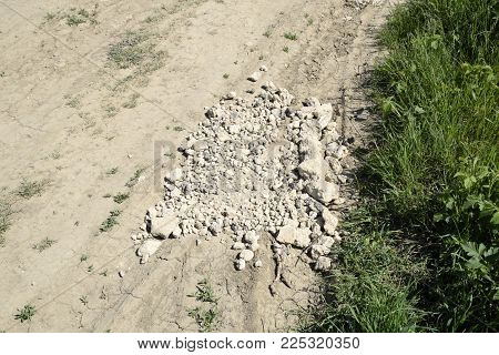 Pits On The Road Are Filled With Stones. Quarry Stone