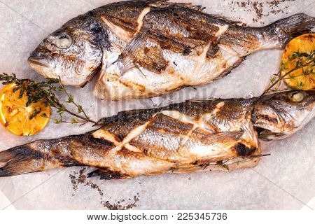 Restaurant dish grilled fish Dorado and Seabass