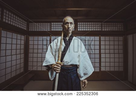 Senior Martial Art Master In His Dojo