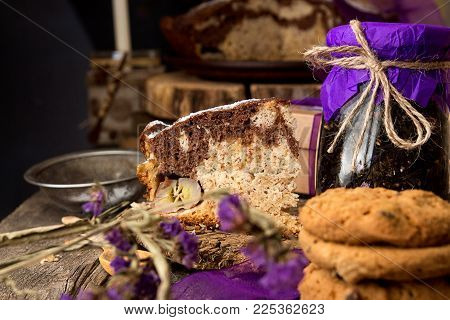 Banana Cake Bread Traditional Pie On Rustic Wooden Surfase And Black Background. Trend Purple Color