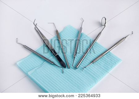 Group of tools and accessories for the dentist. Isolated on white background.