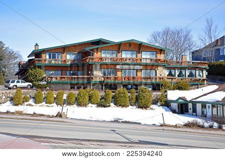 LAKE PLACID, NY, USA - MAR. 20, 2011: Best Western Adirondack Inn in Lake Placid Olympic Center, Lake Placid, New York State, USA. Lake Placid hosted 1932 and 1980 Winter Olympic Games, Adirondack Mountains, New York, USA.