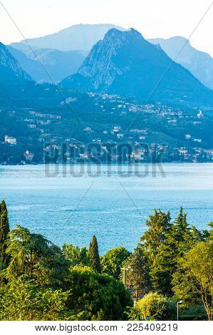 Lake Garda, Italy. Peaceful Sunset Looking Out Over The Lake From Maraschina Toward The Mountains
