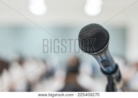 Microphone Voice Speaker With Audiences Or Students In Seminar Classroom, Lecture Hall Or Conference