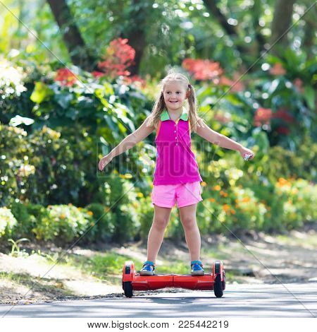 Child On Hover Board. Kids Ride Scooter.