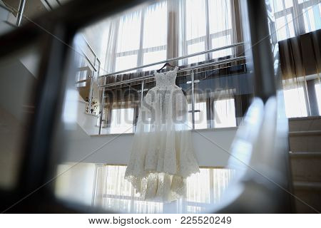 Wedding White Bride Dress On The Background Of A Large Window