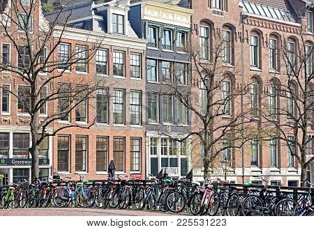 Amsterdam, Netherlands - April 3: A Lot Of Bcycles And Typical Architecture In City  On April 3, 201