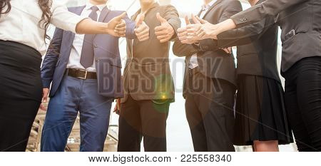Team Business Partners Giving Thumb Up Bump After Complete A Deal. Successful Teamwork Partnership I