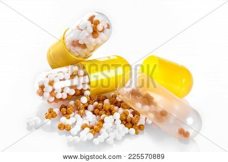 Macro Yellow Medical Pill Tablet With Pellet, Microgranules Isolated On White