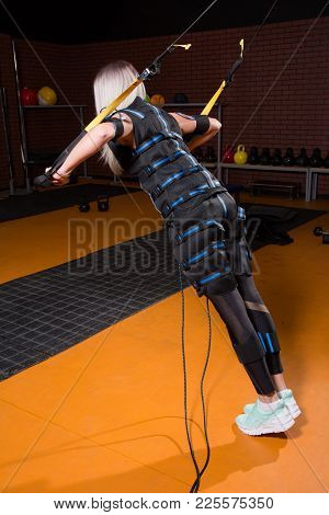 Woman With Back In Electrical Muscular Stimulation