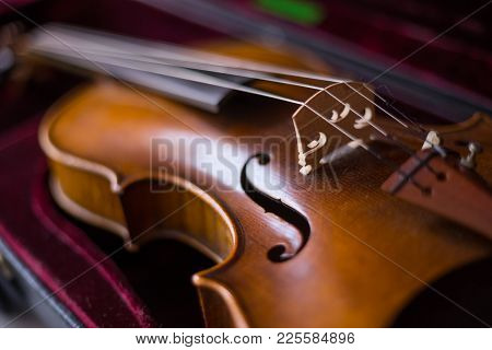 Violin And Bow In Dark Red Case.