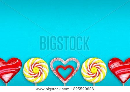Turquoise Gradient Background With Various Lollipops. Lollipop In The Shape Of Heart. Lollipop With 