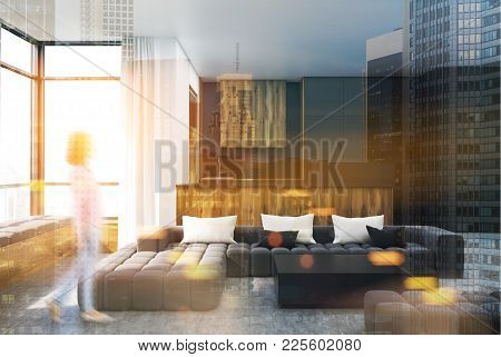 Black And Wooden Living Room Interior With A Black Sofa, A Balck Square Coffee Table And A Kitchen I