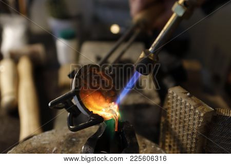 Silver Melting And Casting Into The Form At Jewelers Workshop
