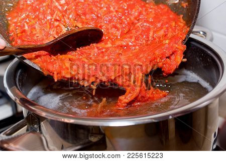 Close Up Adding Roasted Carrot And Beet To Borscht, Vegetable Soup