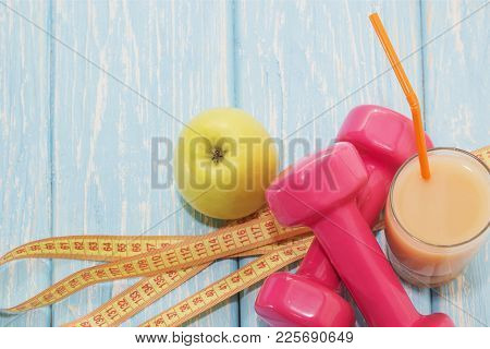 The Concept Of A Healthy Diet. Small Dumbbells, Juice. Bananas. Oranges. Apples. Healthy Lifestyle. 