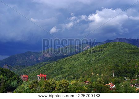 Landscape of Olt Valley with Olt river and Cozia Mountains in Romania