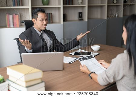 Business People Have A Meeting With Filing Sick Leave In Office. Setup Studio Shooting.