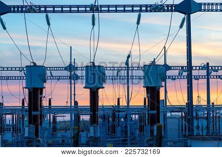 High-voltage Power Lines At Electricity Distribution Station With Connecting Wires