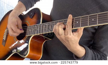 Guitarist Performance Barre On Acoustic Guitar Correctly Clamp Chord Etalon Game Mediator Close-up B