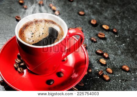 Cup Of Fresh Coffee With Coffee Beans On Stone Table