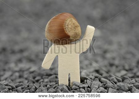 Wooden Male With Hazelnut Instead Of Head
