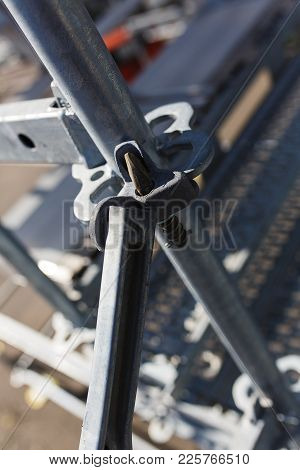 Metal Structures In A Warehouse In Stacks. Metal Supports For Scaffolding And Formwork. Soft Focus A