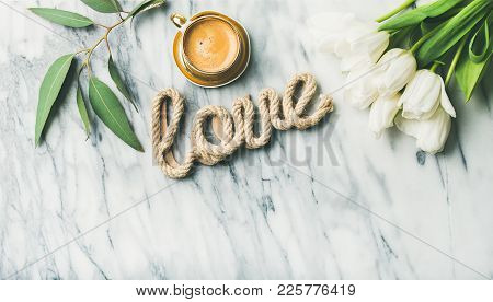 Saint Valentines Day Layout. Flat-lay Of White Tulip Flowers, Cup Of Coffee And Word Love Over Light