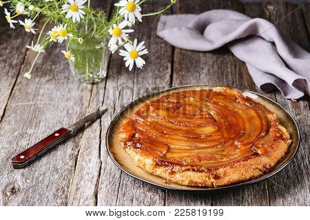 Traditional Homemade Banana Caramel Pie On Vintage Wooden Table Decorated A Bouquet Of Chamomiles. U
