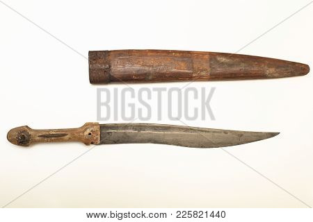 Old Dagger With A Wooden Sheath To Carry The Weapon Isolated On A White Background With Copy Space