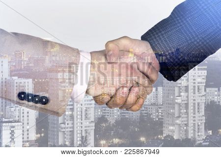 Handshake against the backdrop of a big city, collage, multi-exposure