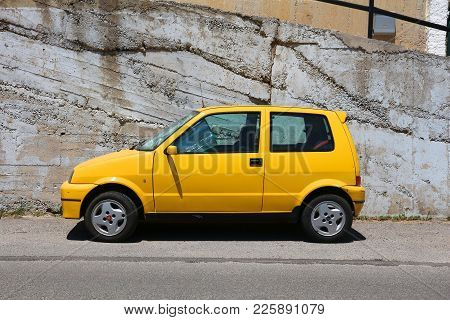 Corfu, Greece - June 2, 2016: Fiat Cinquecento Yellow Hatchback Car Parked In Corfu Island, Greece. 