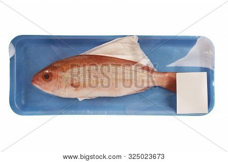Red Snapper Raw Fish In A Styrofoam Container At The Supermarket. Isolated On White Background.