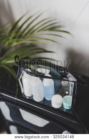 Packing For A Flight, Transparent Bag With Small Lotions For Liquids And Gel For Security Check Comp