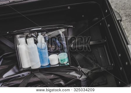 Packing For A Flight, Transparent Bag With Small Lotions For Liquids And Gel For Security Check Comp