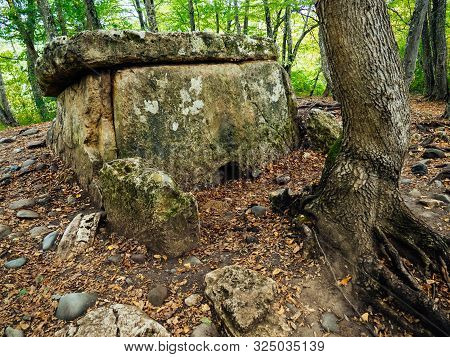 Stone Dolmens. Ancient Burial And Religious Buildings Of Stone Blocks. Autumn Forest