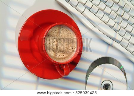 Cup Of Coffee, Dcs And Keyboard On A Studio Background