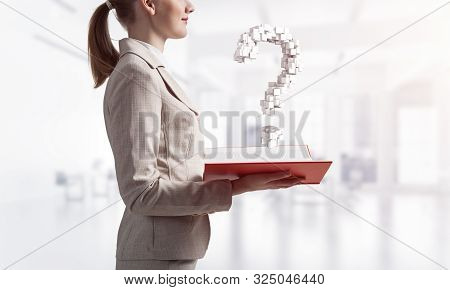 Attractive Woman Holding Open Notebook With Question Mark From Cubes. Business Consultation And Lega
