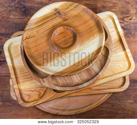 Stack Of The Different Compartmental Dishes And Serving Boards Various Shapes Made With Hardwood On 