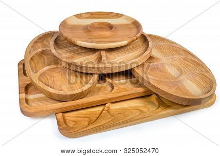 Different Empty Compartmental Dishes And Serving Boards Various Shapes Made With Hardwood On A White