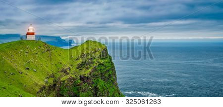 Shot Of Beautiful Panoramic Scene, Kalsoy Island and Kallur lighthouse, Faroe Islands