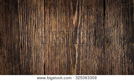 Dark Brown Weathered Wood Plank Texture For Background. Closeup